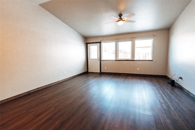 unfurnished room featuring dark hardwood / wood-style floors and ceiling fan