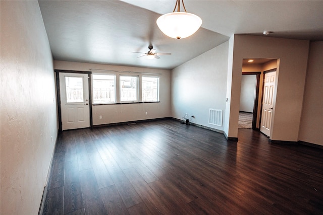 empty room with dark wood-type flooring and ceiling fan