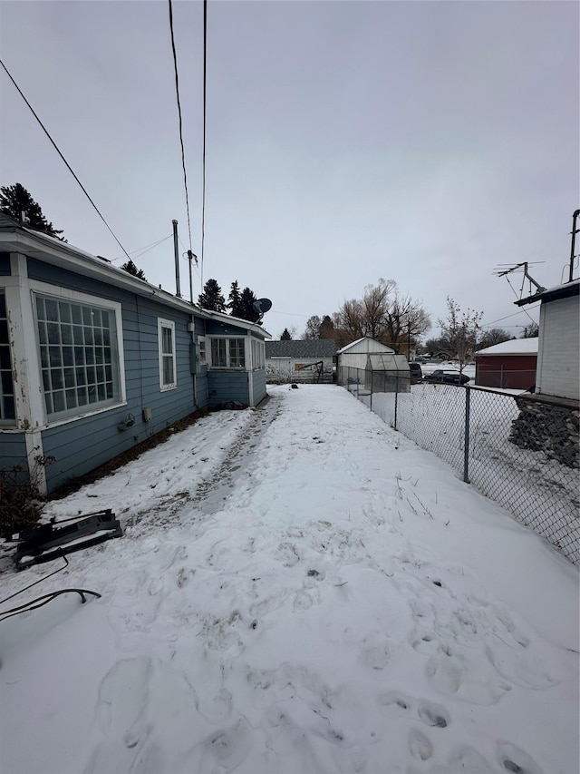 view of yard layered in snow