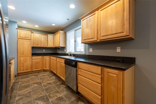 kitchen featuring stainless steel appliances, sink, and light brown cabinets