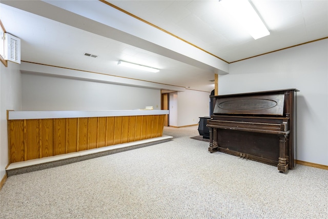 misc room with crown molding and light carpet