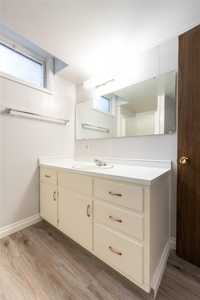 bathroom featuring hardwood / wood-style flooring and vanity