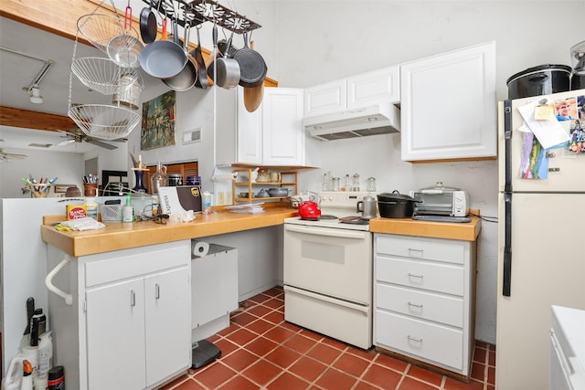 kitchen featuring dark tile patterned floors, white cabinetry, ceiling fan, and white appliances