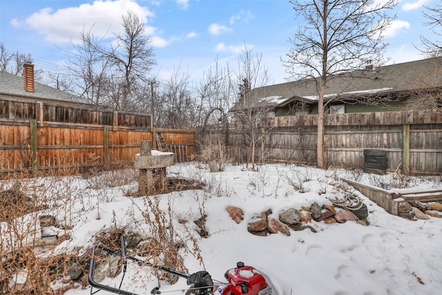 view of yard layered in snow