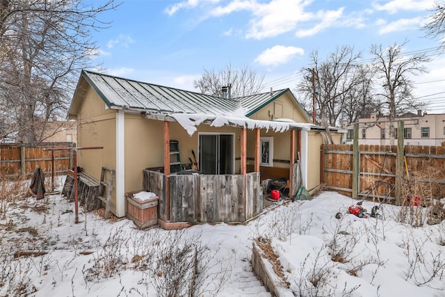 view of snow covered house