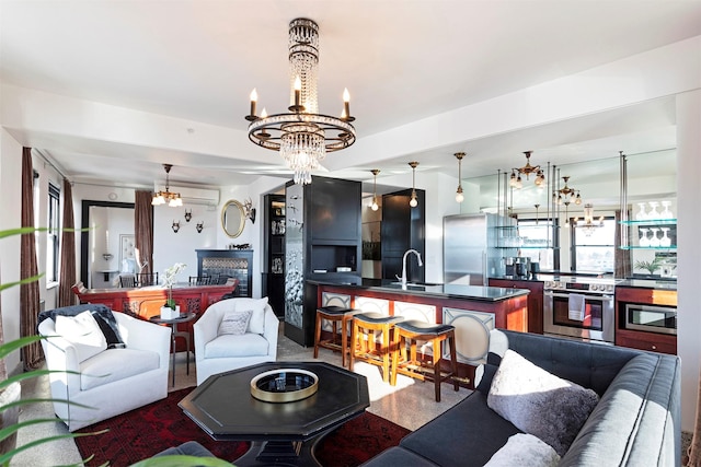 living room with a notable chandelier and sink