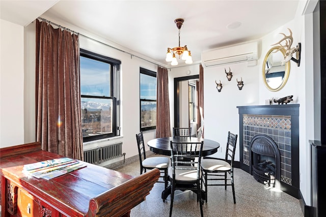 dining room featuring an inviting chandelier, radiator, and an AC wall unit