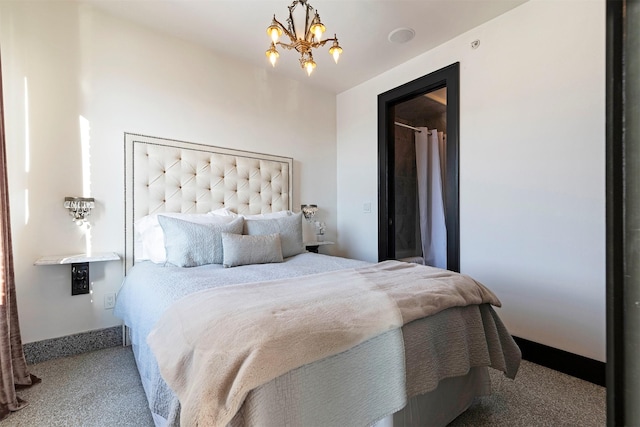 bedroom featuring carpet and a chandelier