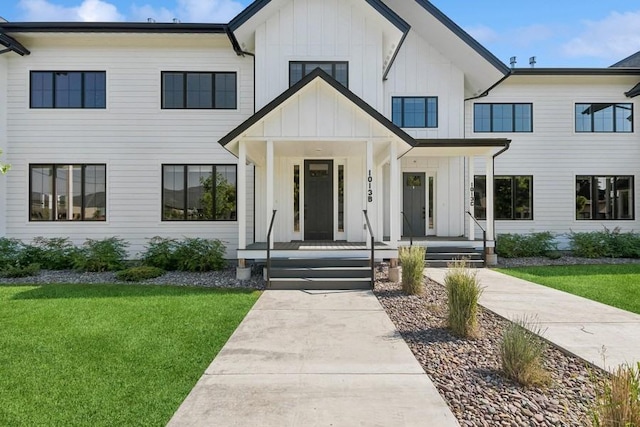 modern farmhouse featuring a front yard