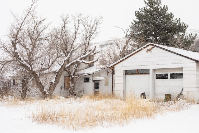 view of snow covered garage