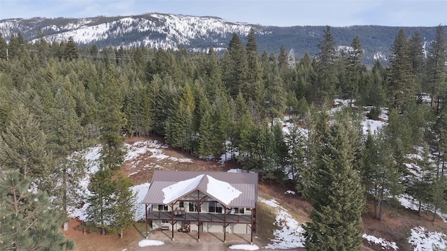 birds eye view of property with a mountain view