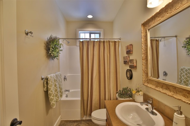 full bathroom featuring shower / bath combo, vanity, and toilet