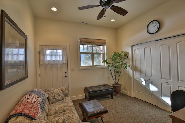 interior space with ceiling fan