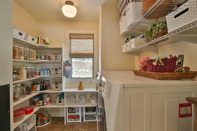 pantry with washer and clothes dryer