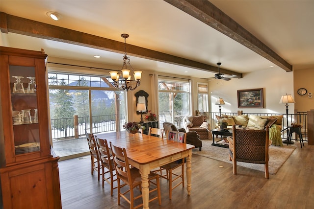 dining area with beamed ceiling, plenty of natural light, and hardwood / wood-style floors