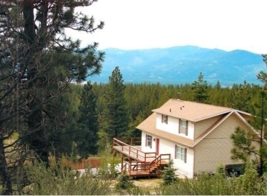 back of house featuring a mountain view