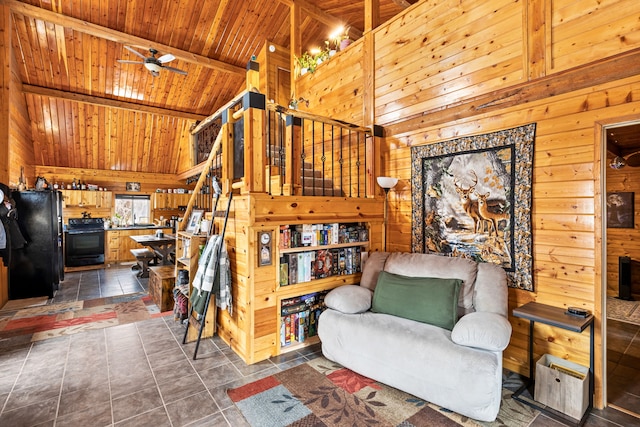 tiled living room with wood ceiling, wooden walls, beam ceiling, and high vaulted ceiling