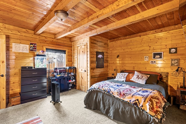 carpeted bedroom with beamed ceiling, wood ceiling, and wood walls