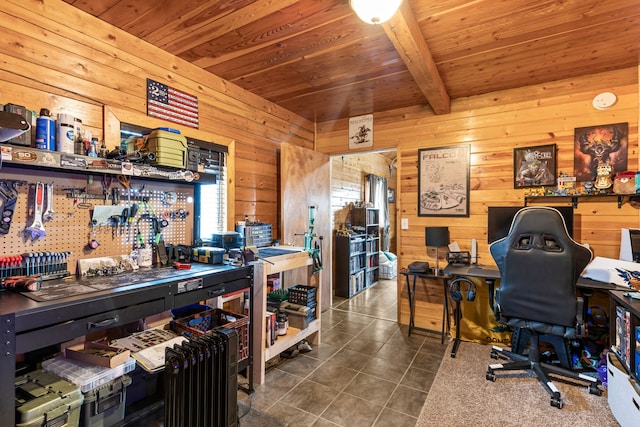 home office with beamed ceiling, dark tile patterned flooring, wood ceiling, and wood walls