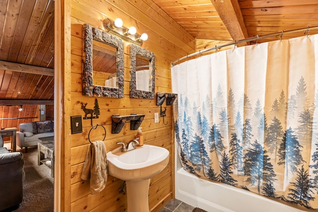 bathroom with lofted ceiling with beams, tile patterned flooring, wooden ceiling, and wood walls