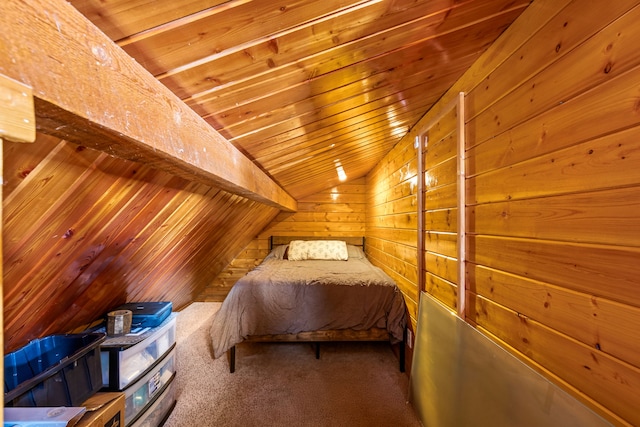 carpeted bedroom with lofted ceiling, wood ceiling, and wood walls