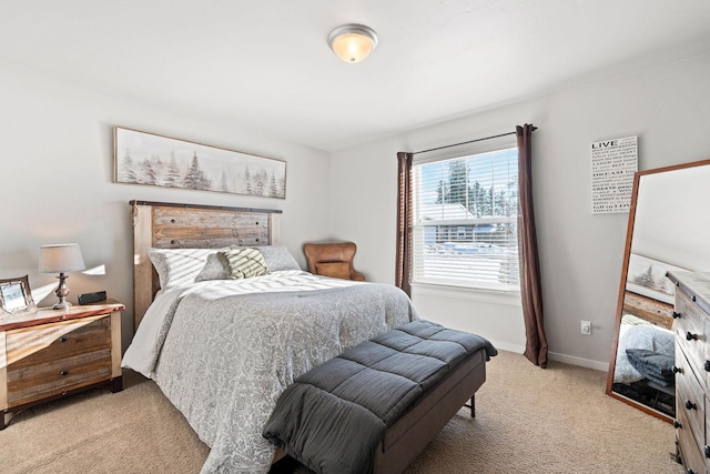 bedroom featuring light carpet