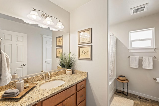 bathroom with vanity and shower / bath combination with curtain