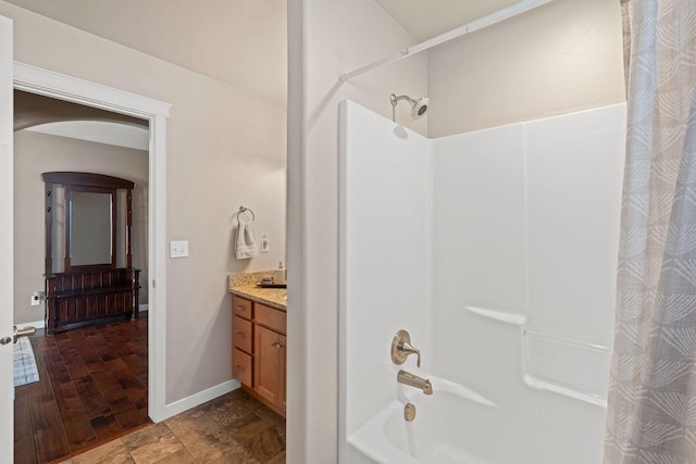 bathroom with vanity and shower / tub combo