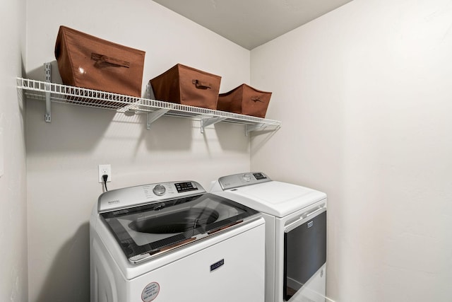 washroom with washing machine and dryer