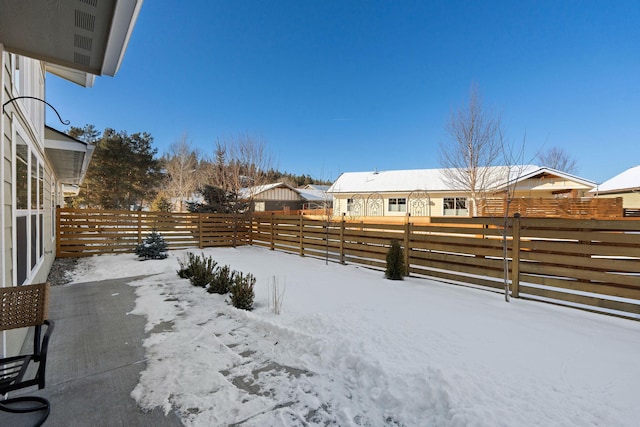 view of yard covered in snow