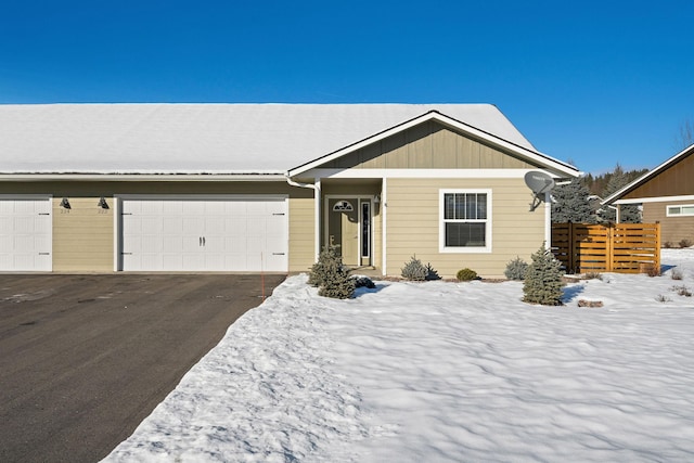 ranch-style home featuring a garage