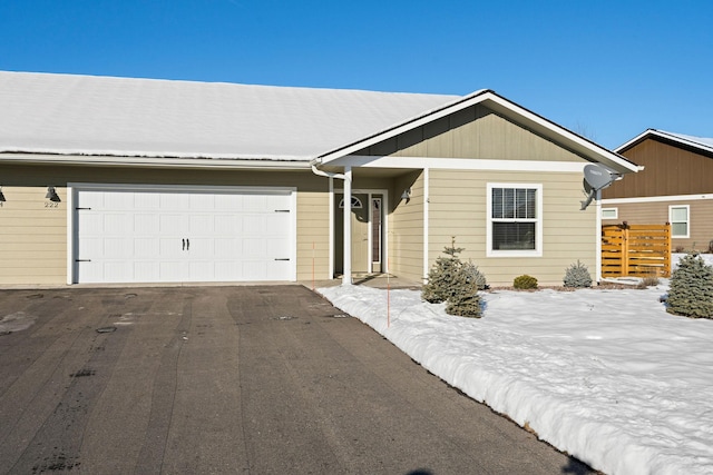 single story home featuring a garage