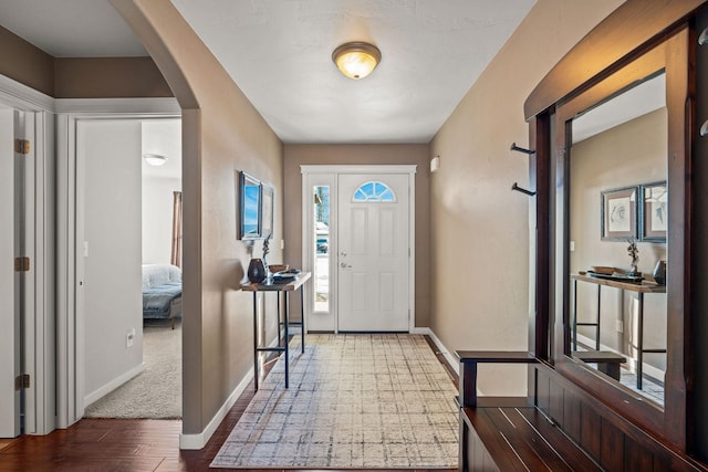 entrance foyer featuring dark hardwood / wood-style floors