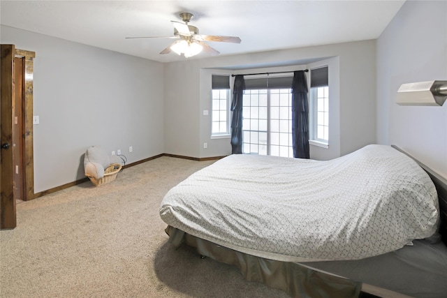 bedroom with ceiling fan and carpet flooring