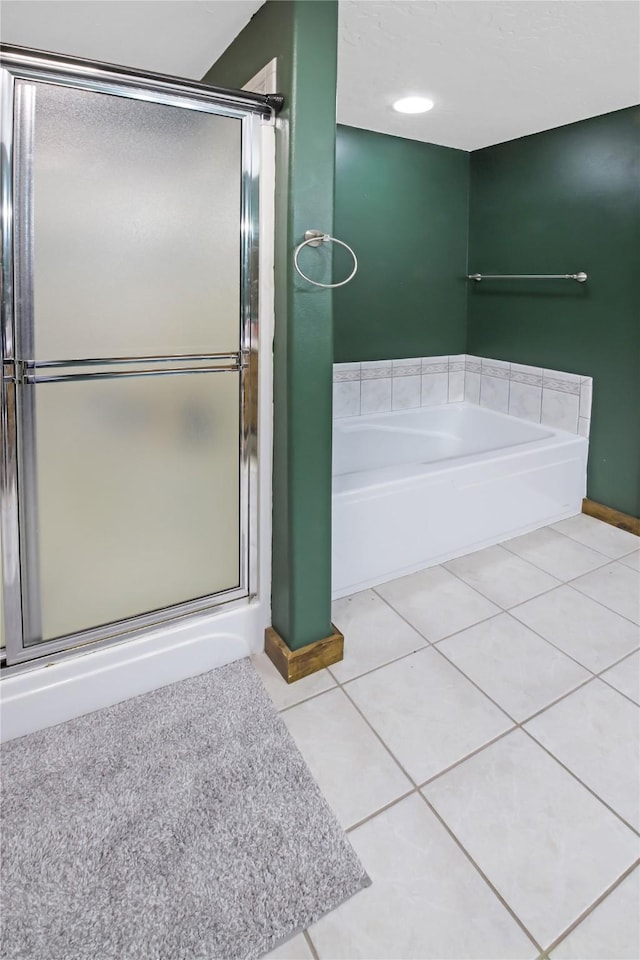 bathroom featuring independent shower and bath and tile patterned floors