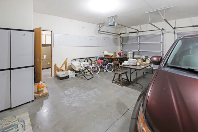 garage featuring a garage door opener