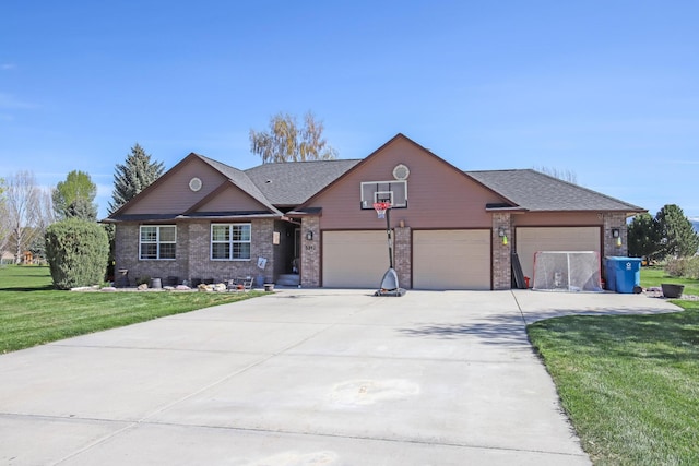 view of front facade with a garage and a front lawn