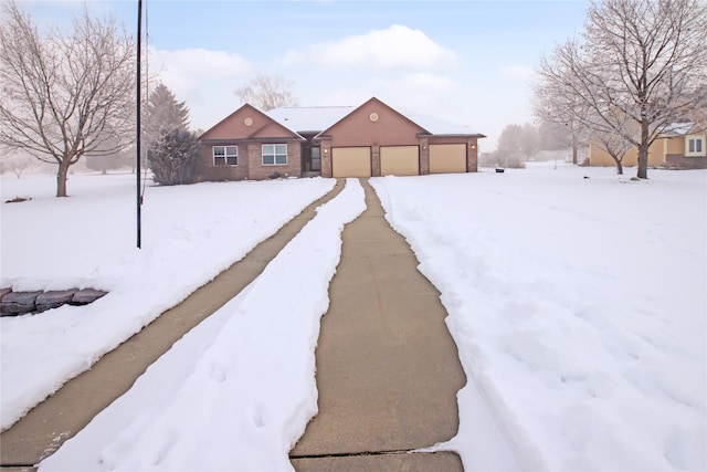 yard covered in snow with a garage