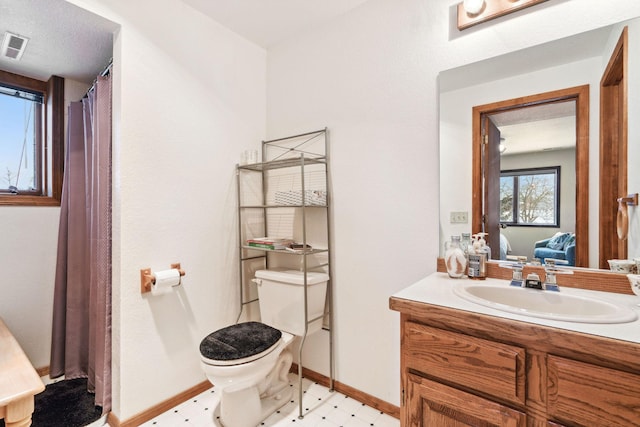 bathroom with vanity and toilet