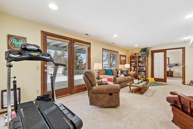 carpeted living room with french doors