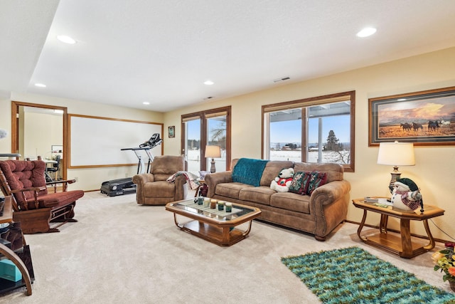 living room featuring light carpet