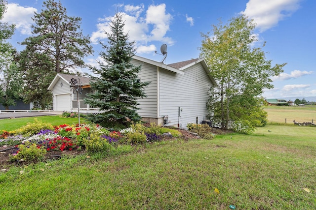 view of side of property featuring a yard