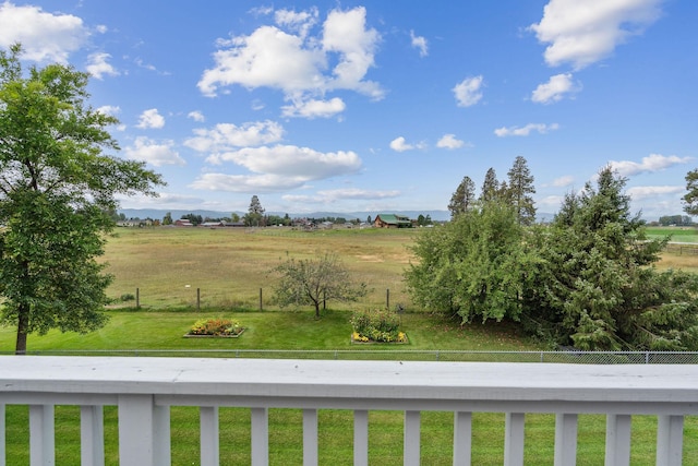 view of yard with a rural view