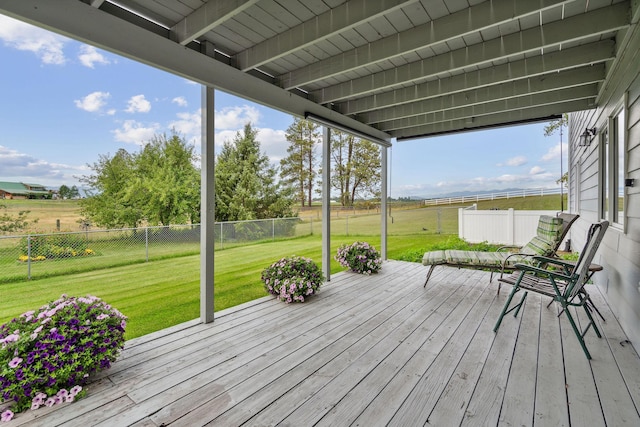 wooden terrace featuring a yard