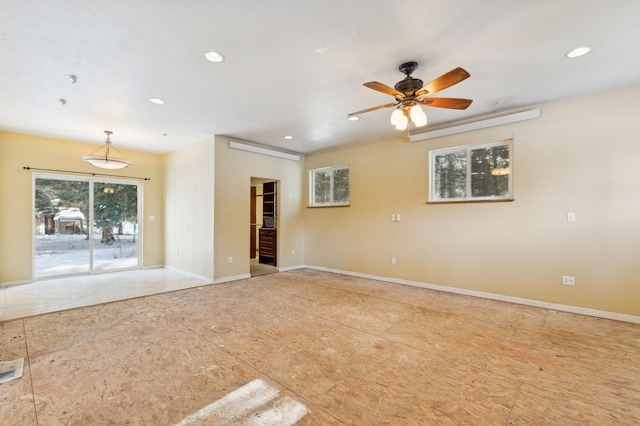 unfurnished room featuring ceiling fan