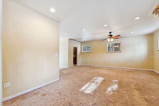 unfurnished room with ceiling fan