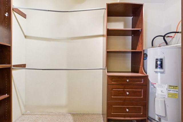 interior space with carpet floors and water heater