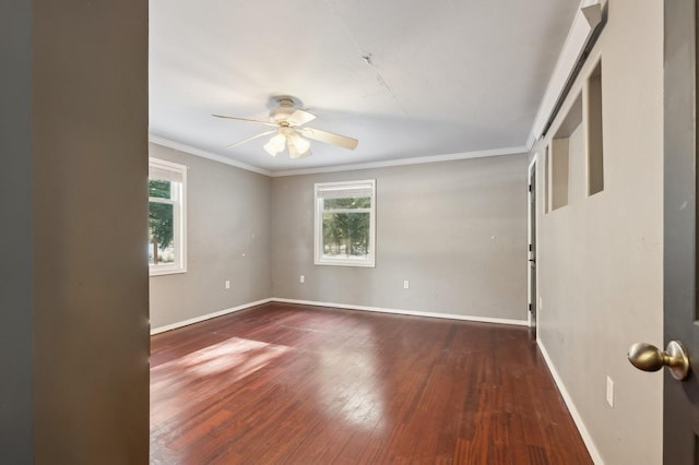 spare room featuring ceiling fan, crown molding, and dark hardwood / wood-style flooring