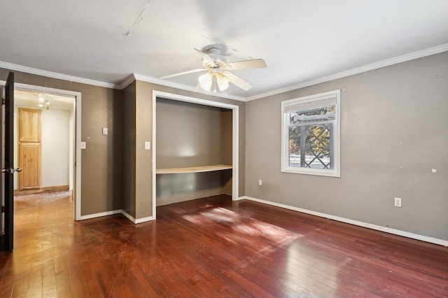 unfurnished bedroom featuring dark hardwood / wood-style flooring, ornamental molding, a closet, and ceiling fan