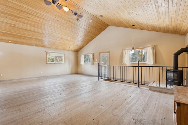 interior space with hardwood / wood-style floors, high vaulted ceiling, wooden ceiling, and a healthy amount of sunlight